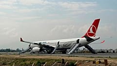 A Turkish Airlines aircraft is seen after passengers were safely evacuated and Nepal's main airport shut down in Kathmandu, 11 May, 2026