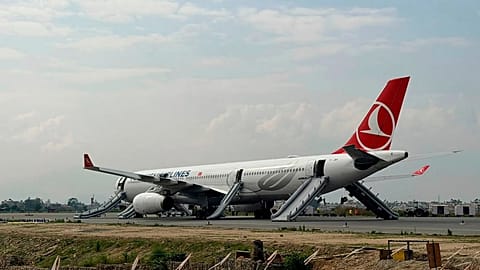 A Turkish Airlines aircraft is seen after passengers were safely evacuated and Nepal's main airport shut down in Kathmandu, 11 May, 2026