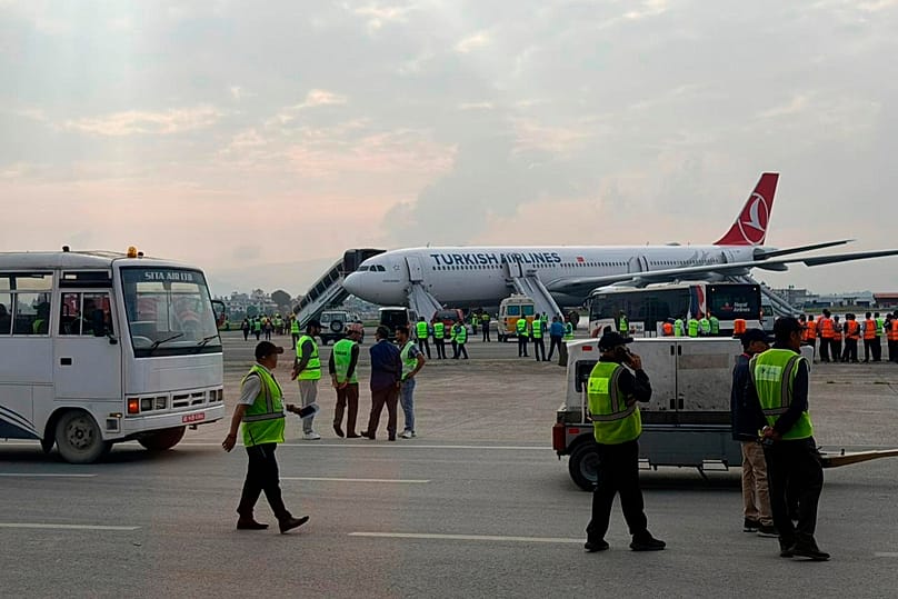 A Turkish Airlines aircraft is seen after passengers were safely evacuated and Nepal's main airport shut down in Kathmandu, 11 May, 2026