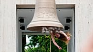 A performer rings a bell with her body at the Austrian pavilion called 'Seaworld Venice' by artist Florentina Holzinger at the Venice 2026 Biennale Art