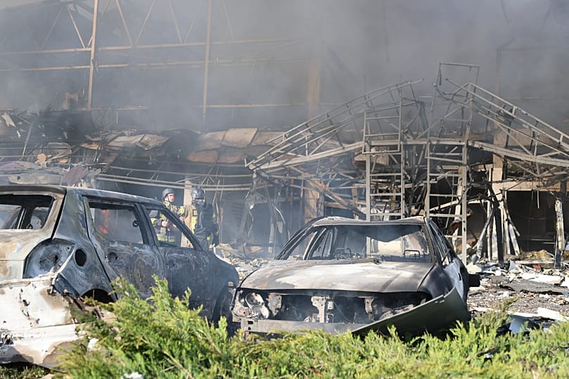 Smoke rises from a car service workshop destroyed by a Russian strike on Zaporizhzhia, 5 May, 2026