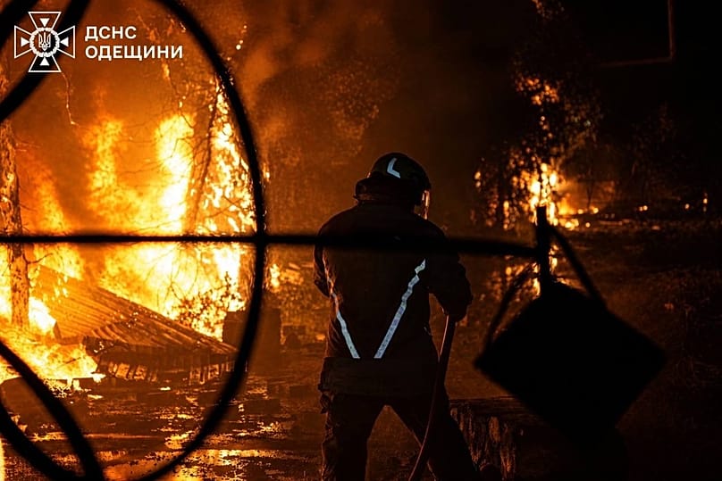 A Ukrainian firefighter puts out a fire after Russia struck the southern Odesa region, 3 May, 2026