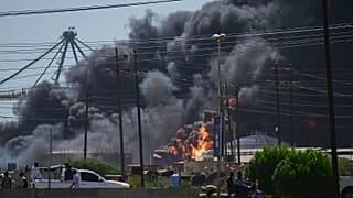 Smoke billows after drone strikes by the paramilitary Rapid Support Forces targeted the northern port in the Red Sea city of Port Sudan, 6 May, 2025