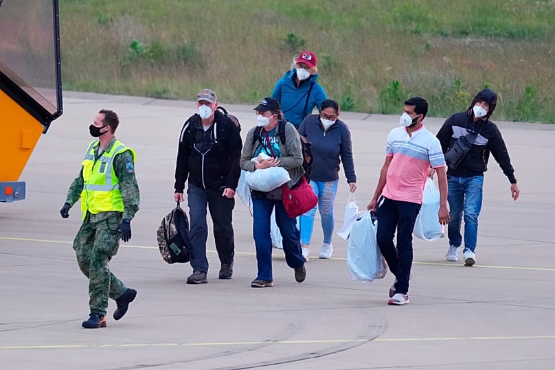 Passengers evacuated from the hantavirus-stricken cruise ship MV Hondius arrive at Eindhoven airport, Netherlands, Sunday, May 10, 2026.