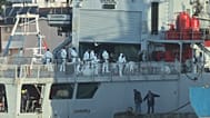 An Italian navy ship docks, as Italy sends 49 more migrants to Albania for processing following earlier court rejections, in the port of Shengjin, northwestern Albania, Tuesda