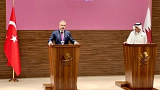 Turkey's Hakan Fidan and Qatar's Sheikh Mohammed bin Abdulrahman Al Thani at a press conference in Doha.