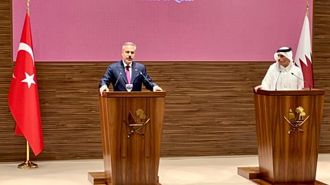 Turkey's Hakan Fidan and Qatar's Sheikh Mohammed bin Abdulrahman Al Thani at a press conference in Doha.