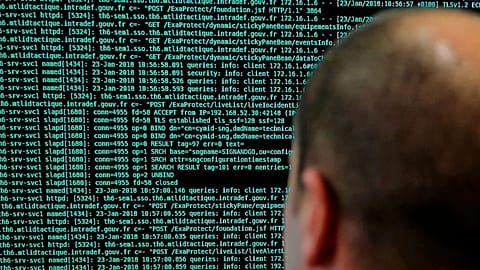 A French solider watches code lines on his computer at the defence ministry, 23 January, 2018 