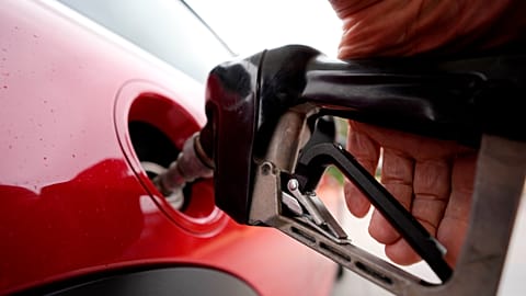 FILE - A motorist pumps petrol at a station in Englewood, Colorado, 5 July 2023