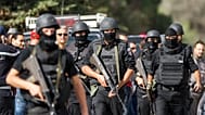 Members of the Tunisian National Guard in the Oued Ellil suburb of Tunis, 23 October, 2014