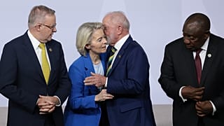 European Commission President Ursula von der Leyen flanked by leaders, including Australia's Prime Minister Anthony Albanese, in Johannesburg, South Africa, 22 November, 2025.