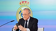 Real Madrid president Florentino Perez reads news on his phone during a press conference in Madrid, Tuesday, May 12, 2026. (AP Photo/Bernat Armangue)