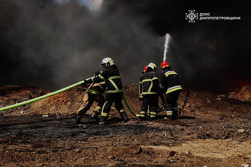 Emergency services personnel work to extinguish a fire following a Russian drone attack on a gas pipeline in Dnipropetrovsk region, 13 May, 2026