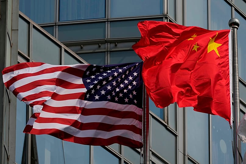 The United States and Chinese flags are flown outside a hotel expected to be used for U.S. President Donald Trump's visit to Beijing Wednesday, May 13, 2026.