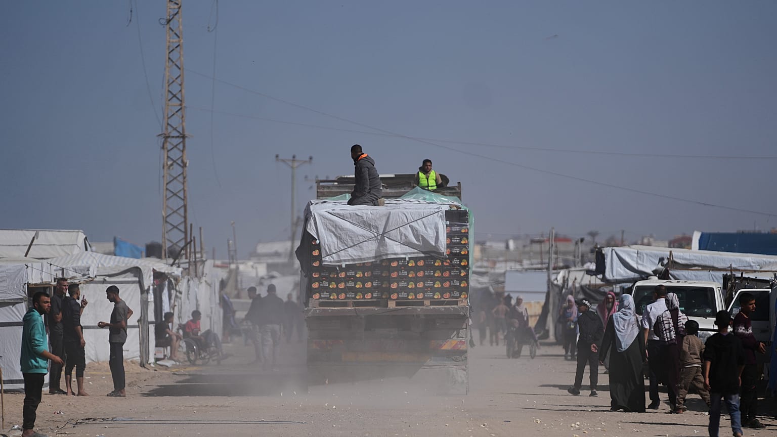FILE: Trucks carrying food, after entering the Gaza Strip through the Kerem Shalom crossing, drive through Khan Younis, 1 February 2026
