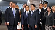 President Donald Trump pauses with China's Vice President Han Zheng during an arrival ceremony Wednesday, May 13, 2026, at Beijing Capital International Airport in Beijing.