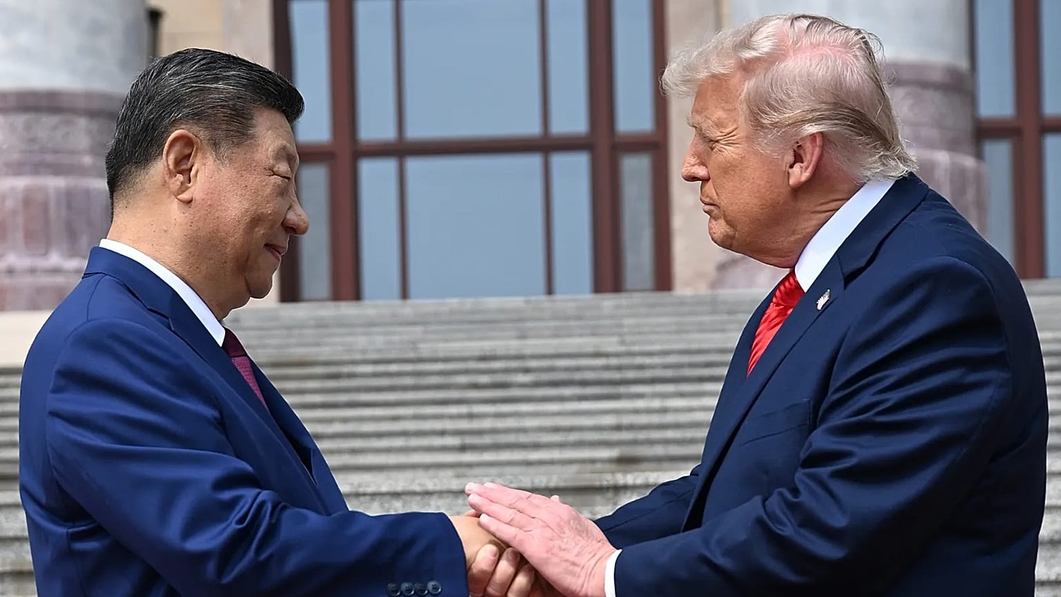 Chinese President Xi Jinping shakes hands with US President Donald Trump at the Great Hall of the People in Beijing, 14 May, 2026