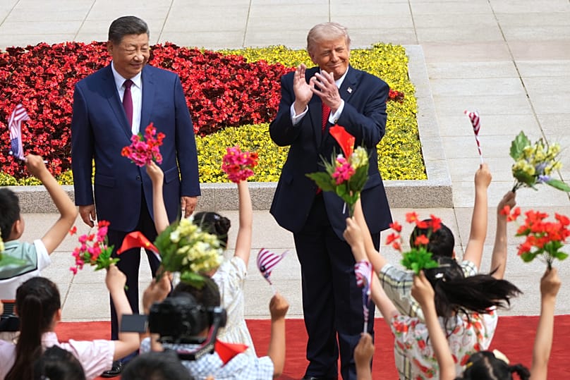 President Donald Trump participates in a welcome ceremony with China's President Xi Jinping at the Great Hall of the People, Thursday, May 14, 2026, in Beijing.