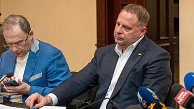 Former Ukrainian president's chief of staff, Andrii Yermak, right, is seen during court hearing in a city court room in Kyiv, Ukraine, Tuesday, May 12, 2026.