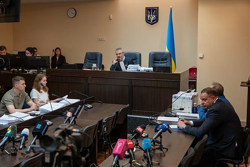 Former Ukrainian president's chief of staff, Andrii Yermak, right, is seen during a court hearing in a city court room in Kyiv, Ukraine, Tuesday, May 12, 2026. 