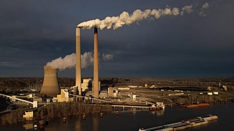A barge on the Ohio River moves past the Mountaineer Power Plant, a coal-fired power plant near New Haven, W.Va., March 13, 2026.