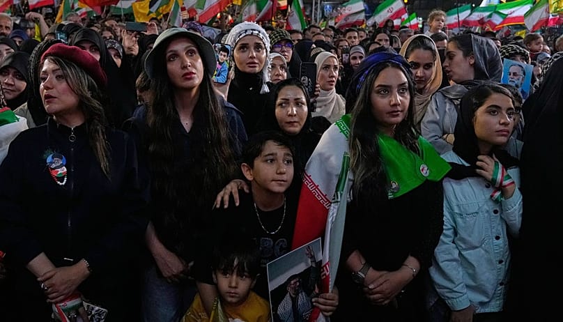 Demonstrators attend a pro-government gathering at Islamic Revolution Square in Tehran, Iran, Wednesday, May 13, 2026. (AP Photo/Vahid Salemi)