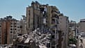 Rescue workers search through the rubble of a building destroyed in an Israeli airstrike the previous day in Dahiyeh, Beirut's southern suburbs, Lebanon, Thursday, May 7, 2026