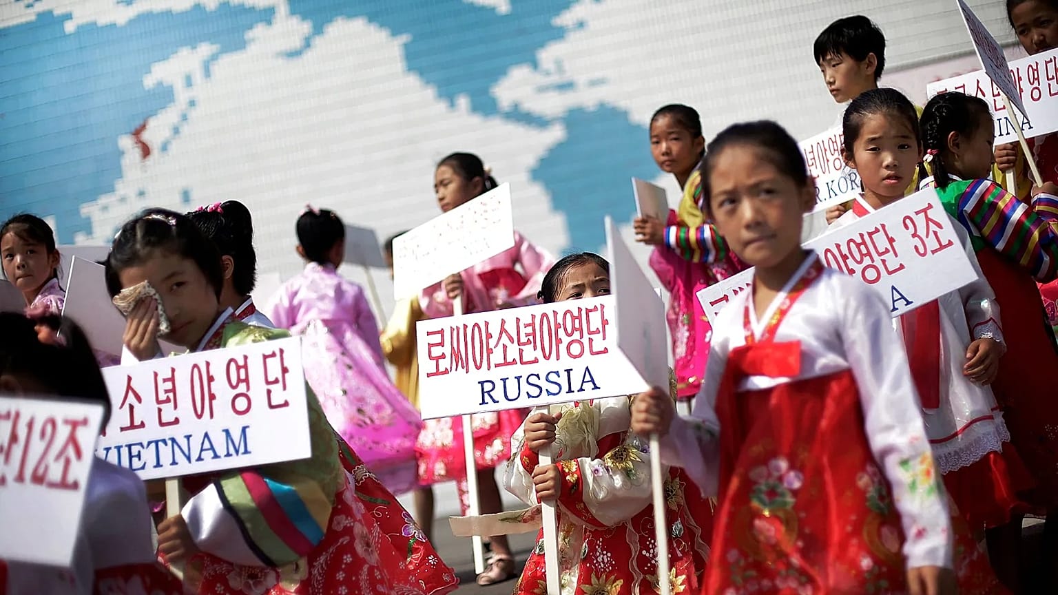 North Korean girls hold up signboards with the names of participating countries during an opening ceremony at the Songdowon International Children's Camp, 29 July, 2014