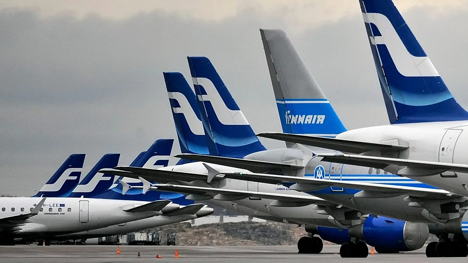 Passenger planes of the Finnish national airline company Finnair stand on the tarmac at Helsinki international airport, 16 November, 2009