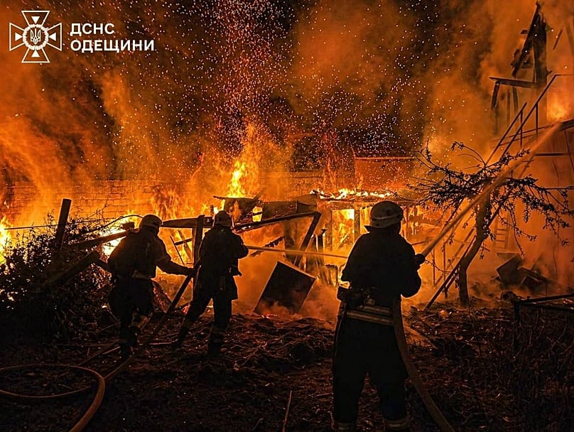Rescue workers put out a fire of a residential building destroyed by a Russian drone strike on Odesa region, 29 April, 2026