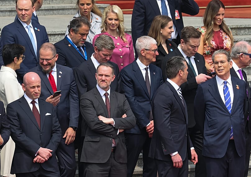 Members of the US delegation, including top CEOs, stand at the Great Hall of the People in Beijing, May 14, 2026. (Maxim Shemetov/Pool Photo via AP)