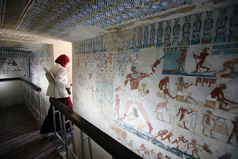 A Visitor leaves the tomb of RabuIa, door keeper of Amun during the 18th Dynasty, in Luxor, Egypt, Thursday, May 14, 2026. 