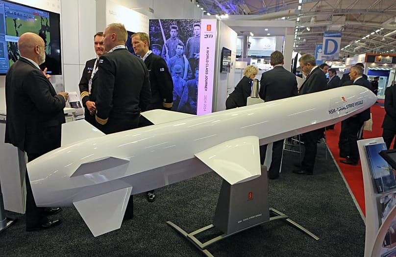 Visitors are gathered next to a display of an NSM Naval Strike Missile made by Norwegian company Kongsberg in Le Bourget, 29 October, 2014