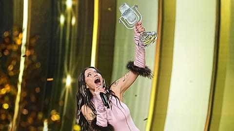 Dara from Bulgaria holds up the trophy after winning the Grand Final of the 70th Eurovision Song Contest in Vienna,