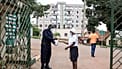 A woman sanitises her hands in front of Kibuli Muslim Hospital in Kampala, Uganda.