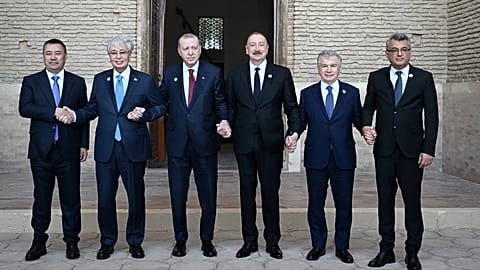 Presidents of Organisation of Turkic States members hold hands in front of mausoleum of Khoja Ahmed Yasawi, in Turkistan, Kazakhstan, 15 May 2026