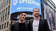 Dropbox co-founders Arash Ferdowski and Drew Houston pose for photos in New York's Times Square during the company's IPO, Mar. 2018