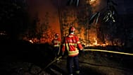 Bombeiros trabalham para extinguir um incêndio nos arredores de Sever do Vouga, Portugal, 18 de setembro de 2024