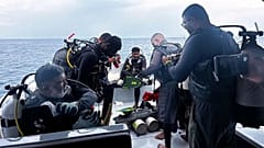 Divers preparing to search for the four missing Italian divers near Alimathaa Island, 15 May, 2026