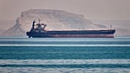 FILE: A bulk cargo ship sits at anchor in the Strait of Hormuz off Bandar Abbas, 2 May 2026
