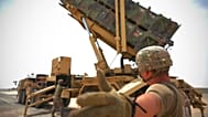 US military personnel at work near a Patriot missile battery at Al-Dhafra Air Base in Abu Dhabi, United Arab Emirates.