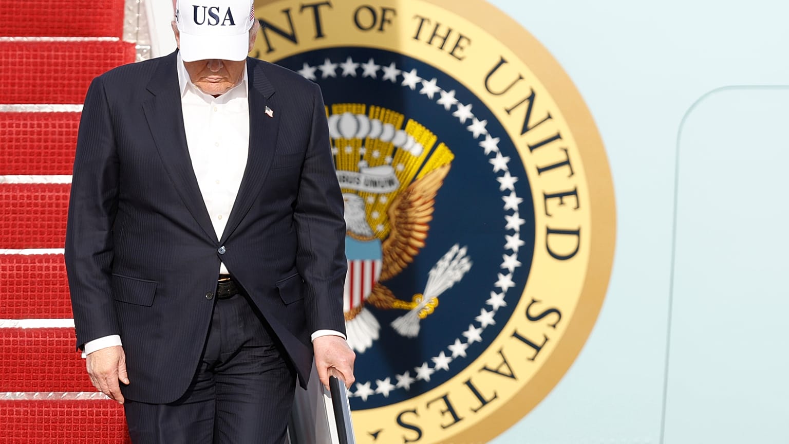 President Donald Trump walks down the stairs of Air Force One upon his arrival at Joint Base Andrews, Md., Friday, May 15, 2026