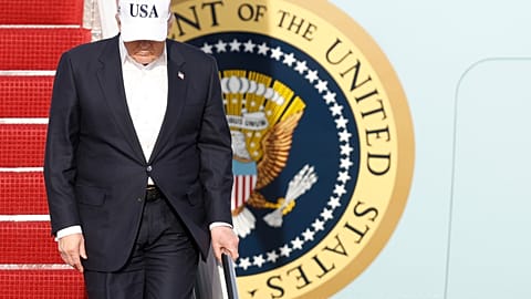 President Donald Trump walks down the stairs of Air Force One upon his arrival at Joint Base Andrews, Md., Friday, May 15, 2026