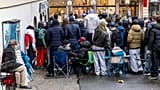 Customers queue to buy the new Royal Pop watch by Swatch and Audemars Piguet, in Geneva,