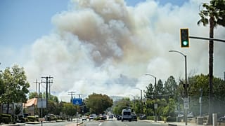 The Sandy Fire sends a plume of smoke in the air on Monday, May 18, 2026, in Simi Valley, Calif.
