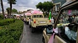 Newlyweds ride in pickup trucks during a mass wedding ceremony for the "Janfada" campaign in Tehran, Iran, Monday, May 18, 2026.