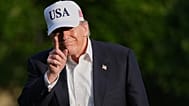President Donald Trump walks across the South Lawn of the White House, Friday, May 15, 2026, in Washington, on return from Beijing.