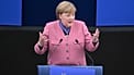 Former German Chancellor Angela Merkel delivers a speech after receiving the European Order of Merit