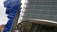 European Union flags flap in the wind outside EU headquarters in Brussels, Tuesday, May 12, 2026. (AP Photo/Virginia Mayo)