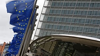 European Union flags flap in the wind outside EU headquarters in Brussels, Tuesday, May 12, 2026. (AP Photo/Virginia Mayo)